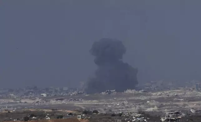 Smoke from an Israeli bombardment rises over the Gaza Strip, seen from southern Israel, Sunday, July 6, 2025. (AP Photo/Ohad Zwigenberg)