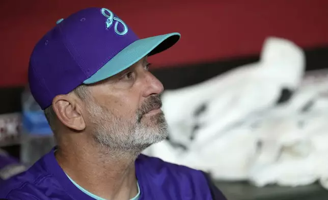 Arizona Diamondbacks manager Torey Lovullo pauses in the dugout prior to a baseball game against the St. Louis Cardinals Friday, July 18, 2025, in Phoenix. (AP Photo/Ross D. Franklin)