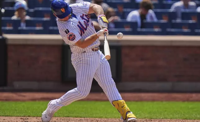 New York Mets' Pete Alonso hits a single during the seventh inning of a baseball game against the Los Angeles Angels Wednesday, July 23, 2025, in New York. (AP Photo/Frank Franklin II)