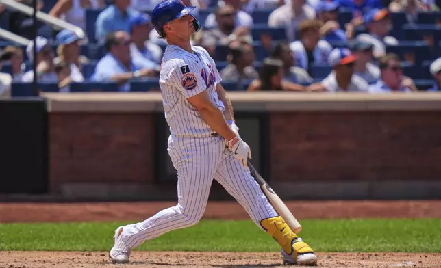 New York Mets' Pete Alonso watches a ball he hit for a three-run home run during the third inning of a baseball game against the Los Angeles Angels Wednesday, July 23, 2025, in New York. (AP Photo/Frank Franklin II)