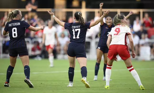 United States forward Sam Coffey (17) celebrates her goal with forward Avery Patterson (8) and others during the first half of an international friendly soccer match against Canada, Wednesday, July 2, 2025, in Washington. (AP Photo/Nick Wass)