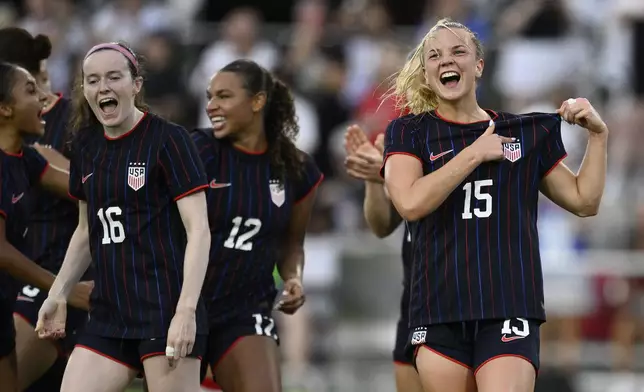 United States midfielder Claire Hutton (15) celebrates her goal with teammates during the first half of an international friendly soccer match against Canada, Wednesday, July 2, 2025, in Washington. (AP Photo/Nick Wass)