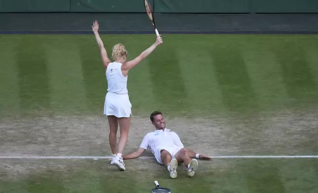 Sem Verbeek of the Netherlands and Katerina Siniakova of Czech Republic celebrate after winning the mixed doubles final match against Joe Salisbury of Britain and Luisa Stefani of Brazil at the Wimbledon Tennis Championships in London, Thursday, July 10, 2025. (AP Photo/Joanna Chan)