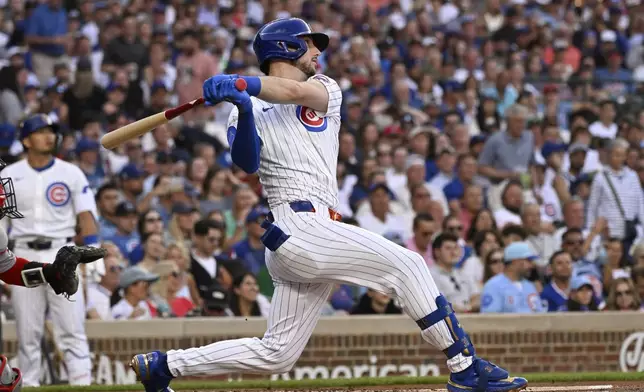 Chicago Cubs' Kyle Tucker hits a home run against the Boston Red Sox during the first inning of a baseball game, Saturday, July 19, 2025, in Chicago. (AP Photo/Matt Marton)