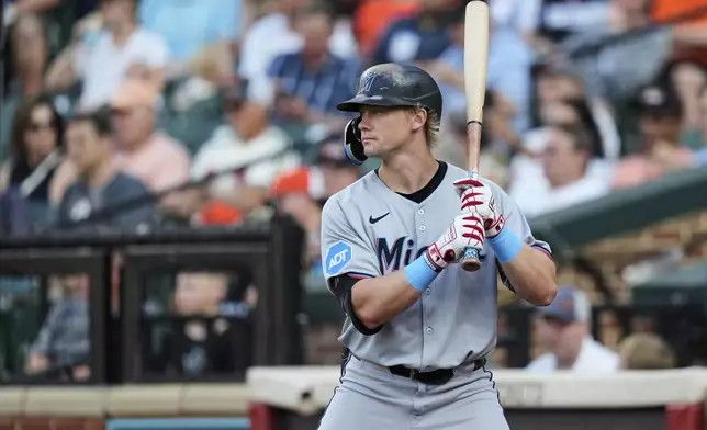 Miami Marlins' Kyle Stowers warms up on-deck during the first inning of a baseball game against the Baltimore Orioles, Friday, July 11, 2025, in Baltimore. (AP Photo/Stephanie Scarbrough)