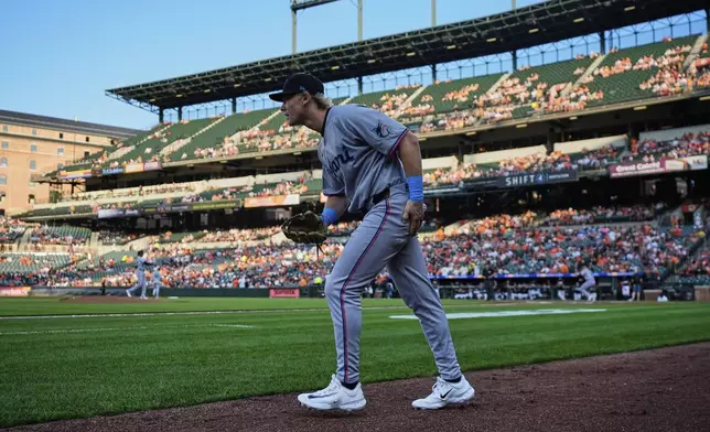 Miami Marlins' Kyle Stowers takes the field during the first inning of a baseball game against the Baltimore Orioles, Friday, July 11, 2025, in Baltimore. (AP Photo/Stephanie Scarbrough)