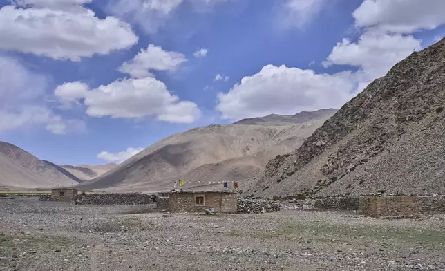 Empty stone-walled structures, or lekhas, used by Changpa nomads to shelter their animals, are visible near Yaye Tso village, Ladakh, India, Monday, July 7, 2025. (AP Photo/ Dar Yasin )