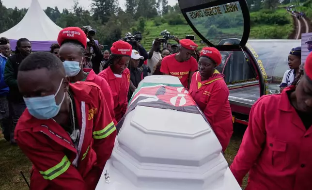 Mourners carry the casket of vendor Boniface Kariuki, who was shot at close range by a police officer, during last month's protests, in Kangema, Muranga County, Kenya, Friday, July 11, 2025. (AP Photo/Brian Inganga)