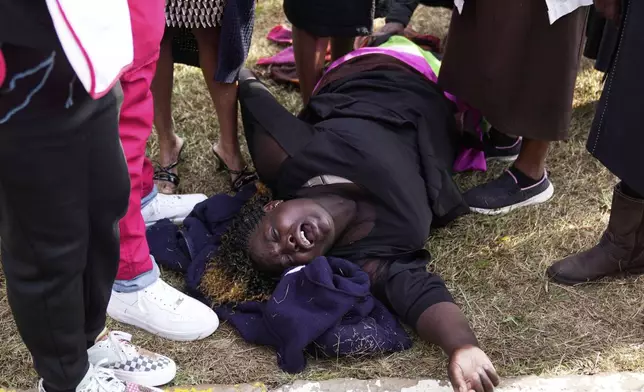 Susan Nyambura Njeri, the mother of vendor Boniface Kariuki, who was shot at close range by a police officer, during last month's protests reacts in grief after viewing the body of her son at the Kenyatta Memorial Funeral Home in Kiambu County, Kenya, Friday, July 11, 2025. (AP Photo/Brian Inganga)