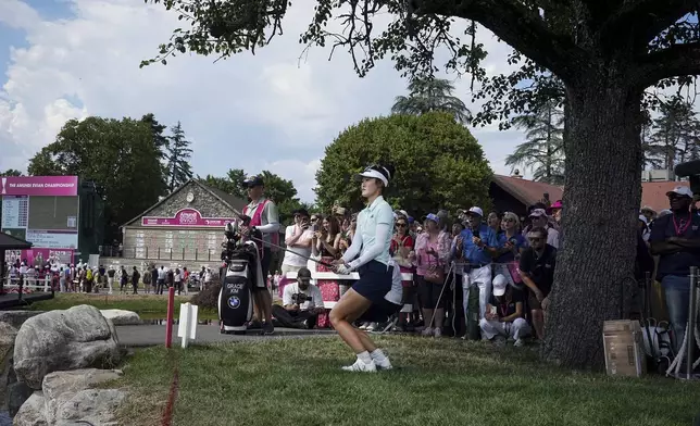 Grace Kim, of Australia, plays on the 18th hole on her way to win the Evian Championship women's golf tournament, in Evian, eastern France, Sunday, July 13, 2025. (AP Photo/Laurent Cipriani)