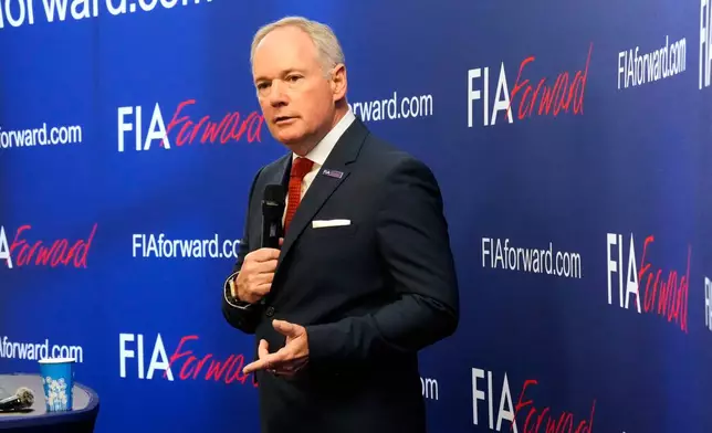 Tim Mayer, the son of former McLaren team principal Teddy Mayer addresses the media after announcing that he is running for the presidency of motorsport's governing body the FIA in December's election, in Whittlebury Park, England, Friday, July 4, 2025. (AP Photo/Darko Bandic)