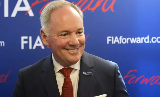 Tim Mayer, the son of former McLaren team principal Teddy Mayer addresses the media after announcing that he is running for the presidency of motorsport's governing body the FIA in December's election, in Whittlebury Park, England, Friday, July 4, 2025. (AP Photo/Darko Bandic)