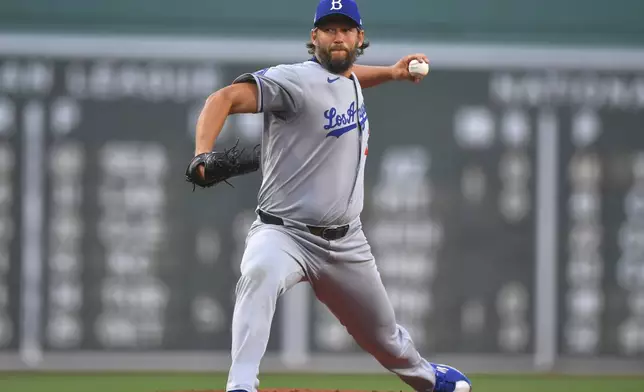 Los Angeles Dodgers' Clayton Kershaw winds up for a pitch to a Boston Red Sox batter in the first inning of a baseball game, Saturday, July 26, 2025, in Boston. (AP Photo/Steven Senne)