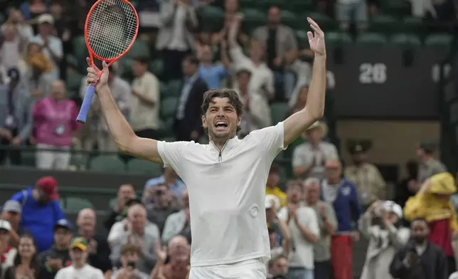 Taylor Fritz of the U.S. reacts after beating Gabriel Diallo of Canada in their second round men's singles match at the Wimbledon Tennis Championships in London, Wednesday, July 2, 2025. (AP Photo/Alastair Grant)