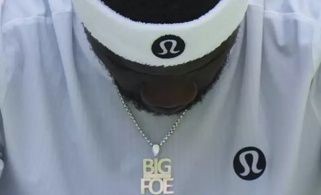 Frances Tiafoe of the U.S. looks down during a change of ends break as he plays Cameron Norrie of Britain during their second round men's singles match at the Wimbledon Tennis Championships in London, Wednesday, July 2, 2025. (AP Photo/Alastair Grant)