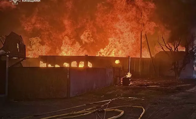 This photo provided by the Ukrainian Emergency Service shows a fire following a Russian attack in Kyiv region, Ukraine, Wednesday, July 9, 2025. (Ukrainian Emergency Service via AP)