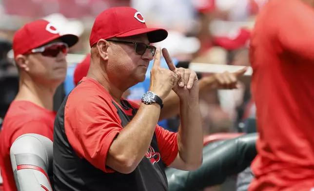 Cincinnati Reds manager Terry Francona signals to his team against the Colorado Rockies during the third inning of a baseball game, Sunday, July 13, 2025, in Cincinnati. (AP Photo/Jay LaPrete)