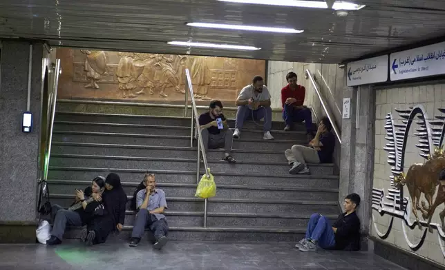 After an emergency evacuation alert, residents seek shelter in a metro station in Tehran, Iran, Tuesday, June 24, 2025. That night, evacuation alerts were issued for two central neighborhoods in the middle of the night. (AP Photo)