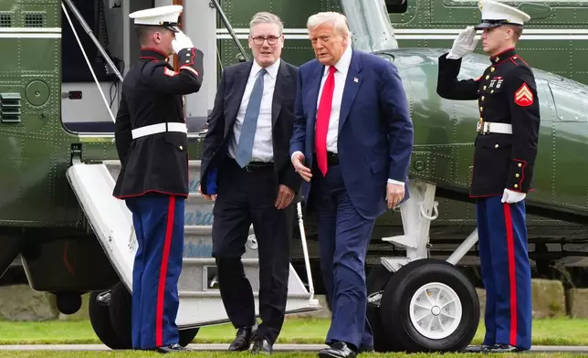 U.S. President Donald Trump, centre right, and British Prime Minister Keir Starmer arrive at Trump International Golf Links in Aberdeenshire, Scotland, Monday, July 28, 2025. (Jane Barlow/Pool Photo via AP)