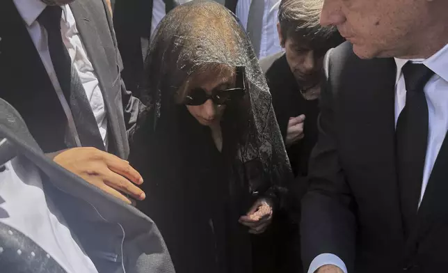 Lebanon's diva Fairuz, centre, one of the Arab world's most popular singers and the mother of Ziad Rahbani, a visionary Lebanese composer, playwright, pianist and political provocateur, who died last Saturday at age 69, arrives to attend her son's funeral at a church in Bekfaya town, mount Lebanon, Monday, July 28, 2025. (AP Photo/Mohammed Anouti)