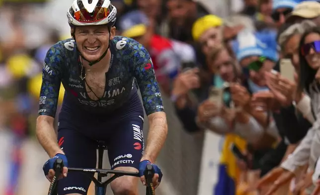 FILE - Matteo Jorgenson of the U.S. crosses the finish line to take a second place in the nineteenth stage of the Tour de France cycling race over 144.6 kilometers (89.9 miles) with start in Embrun and finish in Isola 2000, France, Friday, July 19, 2024. (AP Photo/Daniel Cole, File)