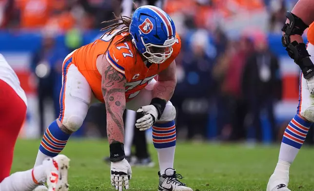 FILE - Denver Broncos guard Quinn Meinerz (77) gets set in the first half of an NFL football game Sunday, Jan. 5, 2025, in Denver. (AP Photo/David Zalubowski, File)