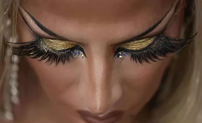 A reveler takes part in a Pride parade marking the culmination of LGBTQ+ Pride month in Panama City, Saturday, June 28, 2025. (AP Photo/Matias Delacroix)