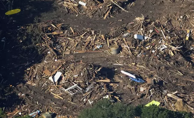 This aerial photo shows damage from flash floods along the Guadalupe River in Kerr County, Texas, Thursday, July 10, 2025. (AP Photo/Gerald Herbert)