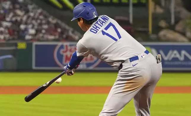 Los Angeles Dodgers' Shohei Ohtani hits into a triple play during the sixth inning of a baseball game against the Los Angeles Angels, Tuesday, Aug. 12, 2025, in Anaheim, Calif. (AP Photo/Mark J. Terrill)