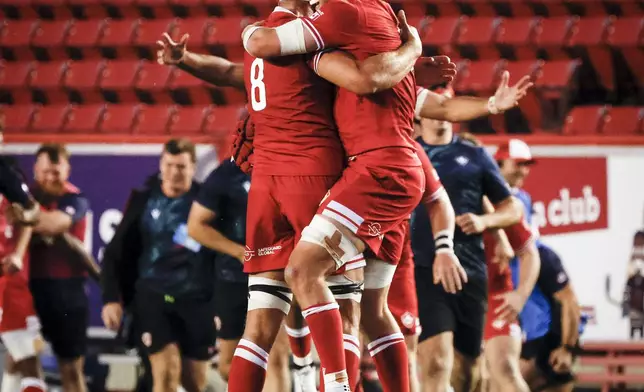 Canada's Tyler Ardron, left, and Piers Von Dadelszen, right, celebrate after defeating the United States in Pacific Nations Cup rugby match action in Calgary, Alberta, Friday, Aug. 22, 2025. (Jeff McIntosh/The Canadian Press via AP)