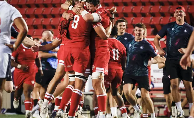 Canada's Tyler Ardron, center left, and Piers Von Dadelszen, center right, celebrate after defeating the United States in Pacific Nations Cup rugby match action in Calgary, Alberta, Friday, Aug. 22, 2025. (Jeff McIntosh/The Canadian Press via AP)