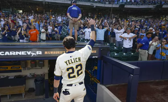 Milwaukee Brewers' Christian Yelich gives the fans a thumbs up after beating the Pittsburgh Pirates in a a baseball game, Wednesday, Aug. 13, 2025, in Milwaukee. (AP Photo/Jeffrey Phelps)