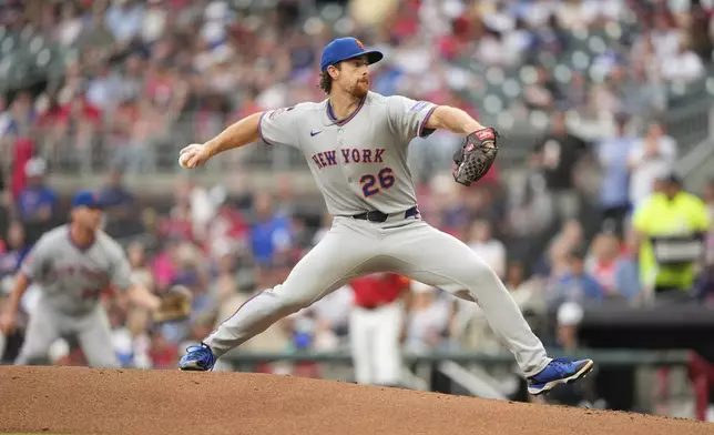 New York Mets pitcher Nolan McLean (26) delivers in the first inning of a baseball game against the Atlanta Braves, Friday, Aug. 22, 2025, in Atlanta. (AP Photo/Brynn Anderson)