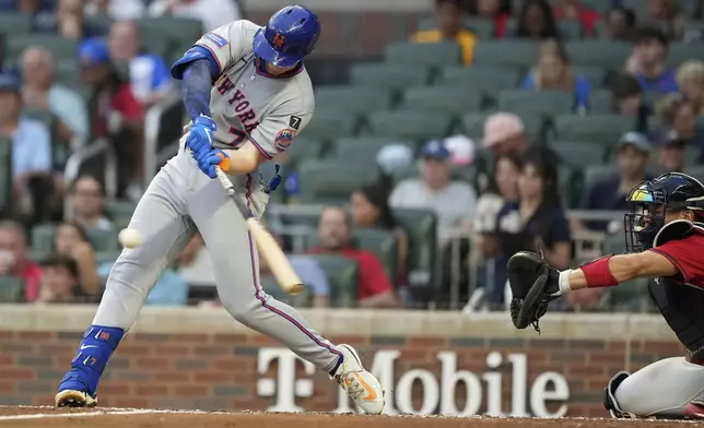New York Mets' Brett Baty (7) hits a double in the third inning of a baseball game against the Atlanta Braves, Friday, Aug. 22, 2025, in Atlanta. (AP Photo/Brynn Anderson)