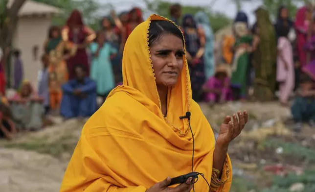 Pakistani folk musician Sham Bhai speaks during an interview with The Associated Press, at a village in Umerkot, a district of Pakistan's southeastern Sindh province, Thursday, July 17, 2025. (AP Photo/Fareed Khan)