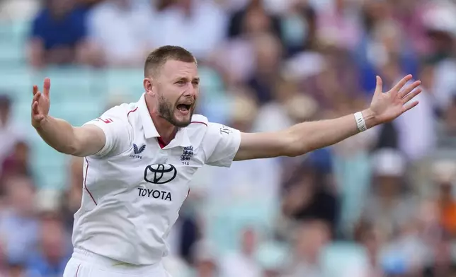 England's Gus Atkinson celebrates the dismissal of India's captain Shubman Gill during the third day of the fifth cricket test match between England and India at The Kia Oval in London, Saturday, Aug. 2, 2025. (AP Photo/Kirsty Wigglesworth)