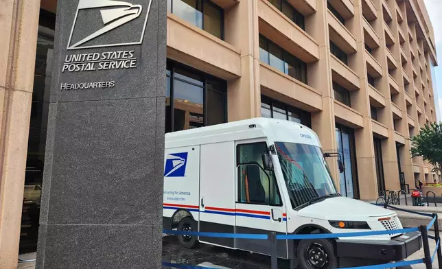 One of the U.S. Postal Service's new zero-emission electric Next Generation Delivery Vehicles (NGDV) is displayed in front of the organization's headquarters in Washington, on Aug. 7, 2025. (AP Photo/Susan Haigh)