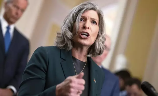 FILE - Sen. Joni Ernst, R-Iowa, speak to reporters after a closed-door meeting with fellow Republicans, at the Capitol in Washington, Sept. 24, 2024. (AP Photo/J. Scott Applewhite, File)
