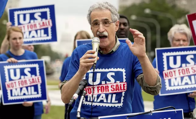 FILE - American Postal Workers Union President Mark Dimondstein speaks at a rally, Oct. 8, 2018, in Washington. (AP Photo/Andrew Harnik)