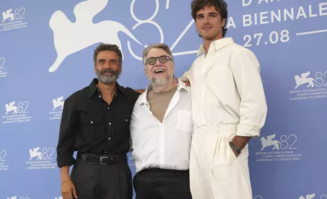 Oscar Isaac, from left, director Guillermo del Toro and Jacob Elordi pose for photographers at the photo call for the film 'Frankenstein' during the 82nd edition of the Venice Film Festival in Venice, Italy, on Saturday, Aug. 30, 2025. (Photo by Alessandra Tarantino/Invision/AP)