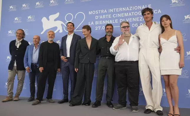 Composer Alexandre Desplat, from left, producer J. Miles Dale, Christoph Waltz, producer Scott Stuber, Felix Kammerer, Oscar Isaac, director Guillermo del Toro, Jacob Elordi and Mia Goth pose for photographers at the photo call for the film 'Frankenstein' during the 82nd edition of the Venice Film Festival in Venice, Italy, on Saturday, Aug. 30, 2025. (Photo by Alessandra Tarantino/Invision/AP)