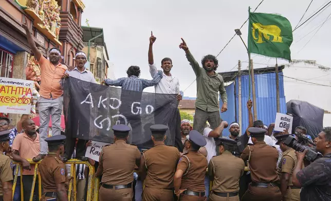 Supporters of former president of Sri Lanka Ranil Wickremesinghe celebrate after a court granted him bail, in Colombo, Sri Lanka, Tuesday, Aug. 26, 2025. (AP Photo/Eranga Jayawardena)