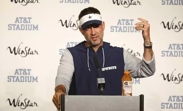 Dallas Cowboys head coach Brian Schottenheimer responds to questions during a news conference after the team's preseason NFL football game against the Baltimore Ravens Saturday, Aug. 16, 2025, in Arlington, Texas. (AP Photo/Richard Rodriguez)