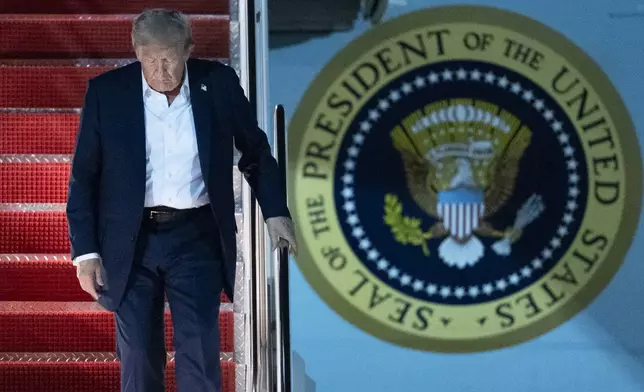 President Donald Trump disembarks Air Force One as he arrives at Joint Base Andrews, Md., early Saturday, Aug. 16, 2025, from a summit with Russian President Vladimir Putin in Anchorage, Alaska. (AP Photo/Manuel Balce Ceneta)