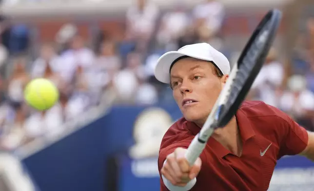 Jannik Sinner, of Italy, returns a shot against Denis Shapovalov, of Canada, during the third round of the U.S. Open tennis championships, Saturday, Aug. 30, 2025, in New York. (AP Photo/Kirsty Wigglesworth)