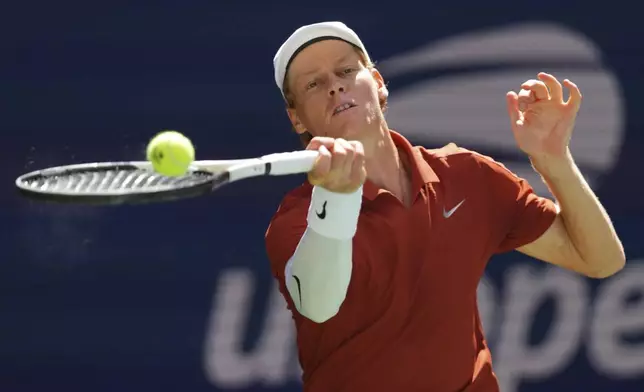 Jannik Sinner, of Italy, returns a shot against Denis Shapovalov, of Canada, during the third round of the U.S. Open tennis championships, Saturday, Aug. 30, 2025, in New York. (AP Photo/Kirsty Wigglesworth)