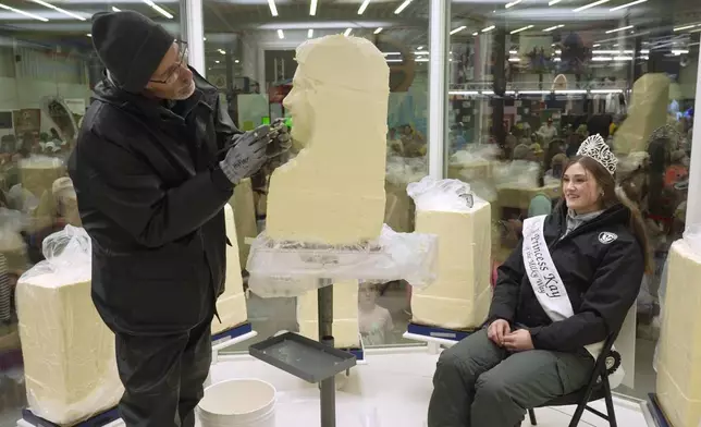 Sculptor Gerry Kulzer carves the likeness of Malorie Thorson, this year's Princess Kay of the Milky Way, out of a block of butter at the Minnesota State Fair, Thursday, Aug. 21, 2025 in Falcon Heights, Minn. (AP Photo/Mark Vancleave)