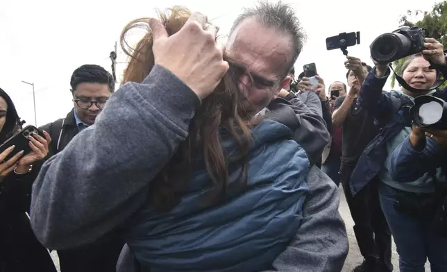 Israel Vallarta hugs his family as he leaves Altiplano maximum security prison after a judge ordered his release in Almoloya, near Mexico City, Friday, Aug. 1, 2025. Vallarta served almost 20 years behind bars for being the leader of a kidnapping ring before a judge ruled on Thursday that the evidence didn't support the charges against him. (AP Photo/Haaron Alvarez)
