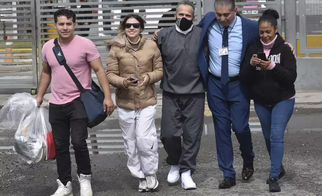Israel Vallarta, center, leaves Altiplano maximum security prison surrounded by family and his lawyer after a judge ordered his release in Almoloya, near Mexico City, Friday, Aug. 1, 2025. Vallarta served almost 20 years behind bars for being the leader of a kidnapping ring before a judge ruled on Thursday that the evidence didn't support the charges against him. (AP Photo/Haaron Alvarez)