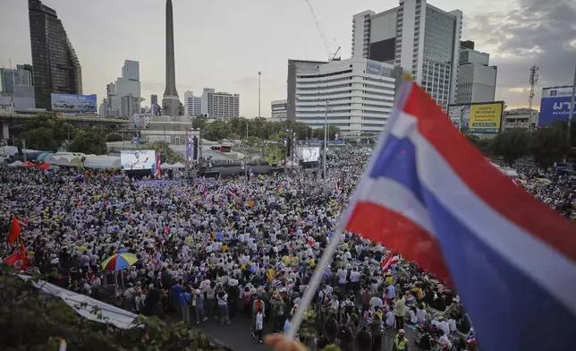 Protesters waving Thailand flags gather at Victory Monument demanding Prime Minister Paetongtarn Shinawatra resign in Bangkok, Thailand, Saturday, Aug. 2, 2025. (AP Photo/Tadchakorn Kitchaiphon)